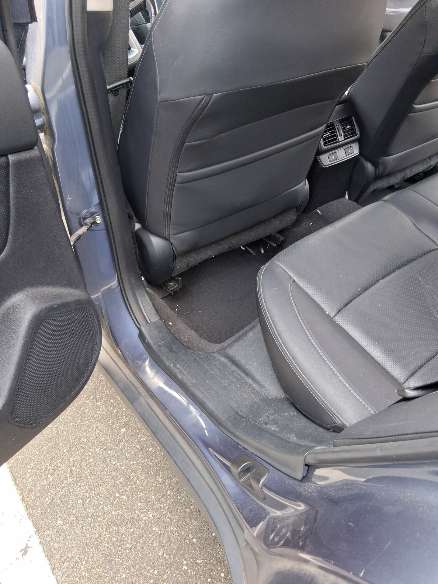 Cleaned rear cabin with spotless seats, panels, and carpet